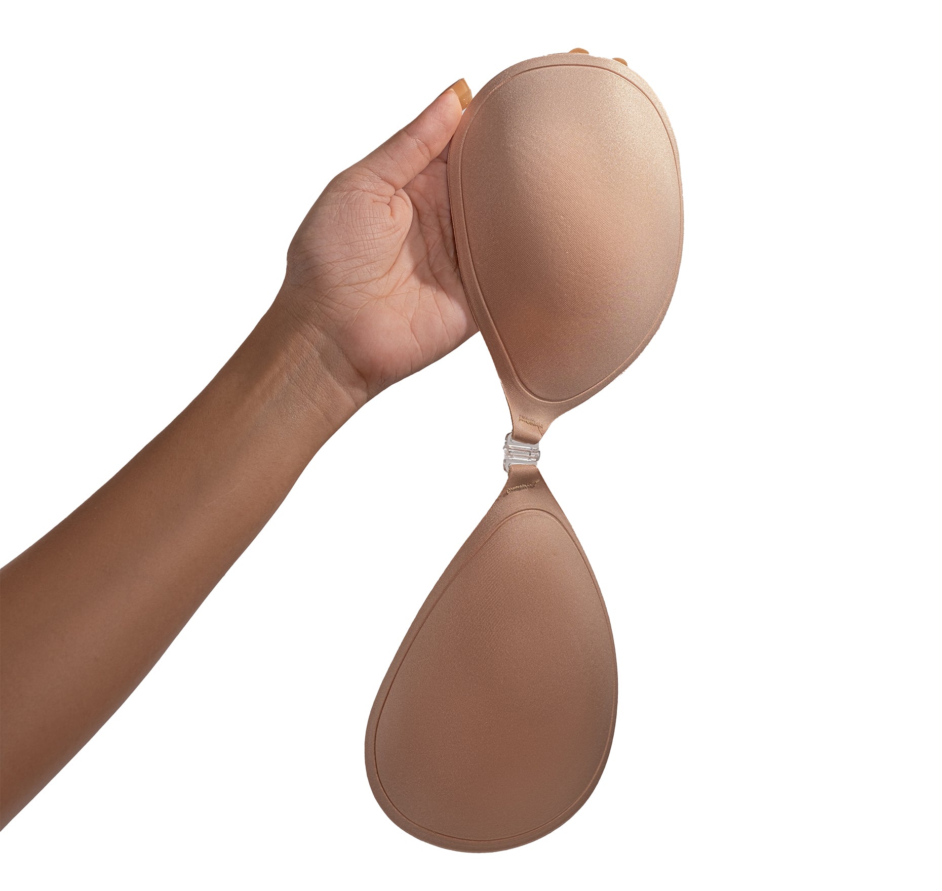 A hand holding Nippetals BareEase backless bra, showcasing its premium design for innovative wardrobe solutions