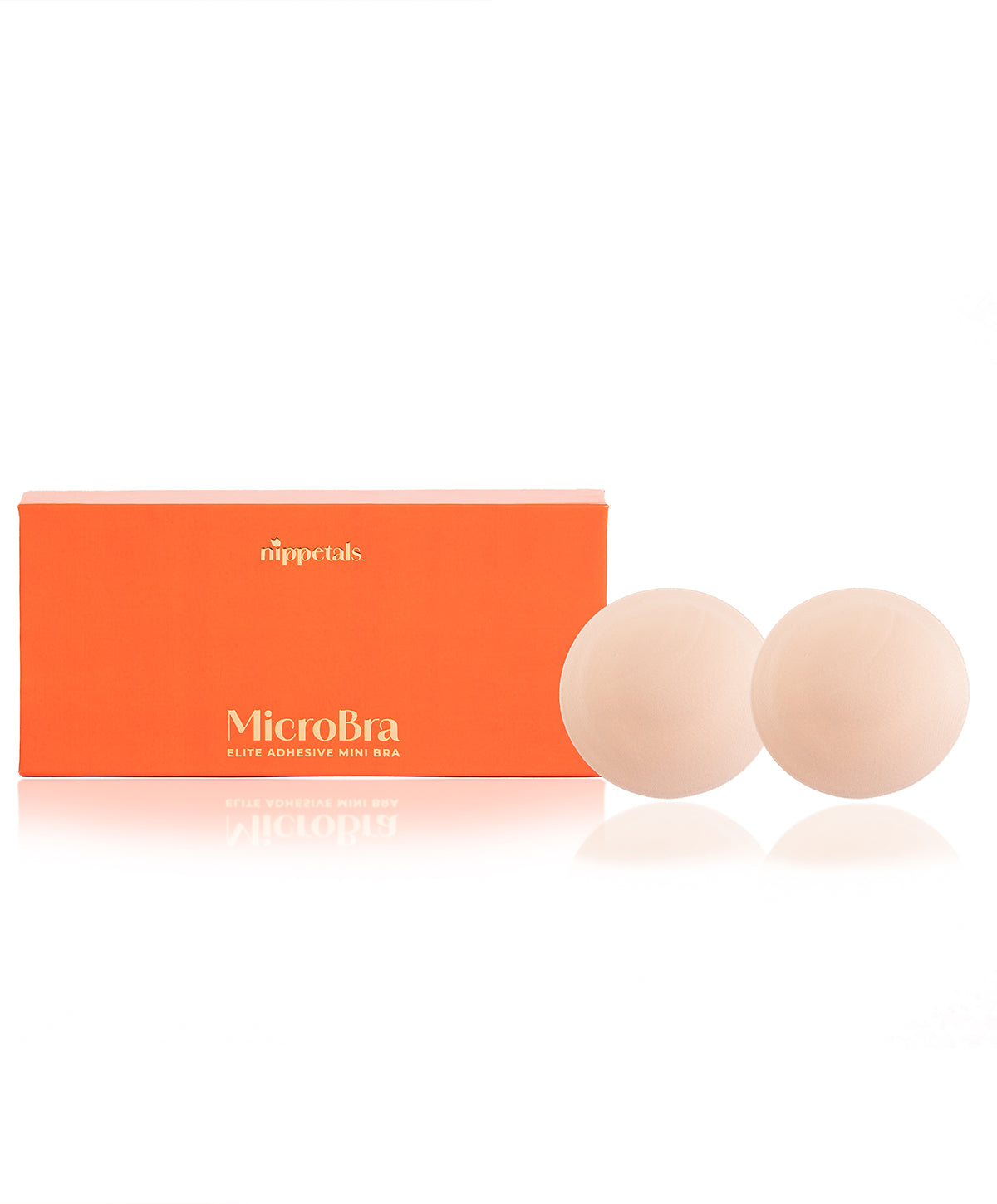 Nippetals MicroBra-Elite Adhesive Mini Bra displayed in front of its packaging box, showing a sleek design for discreet fit