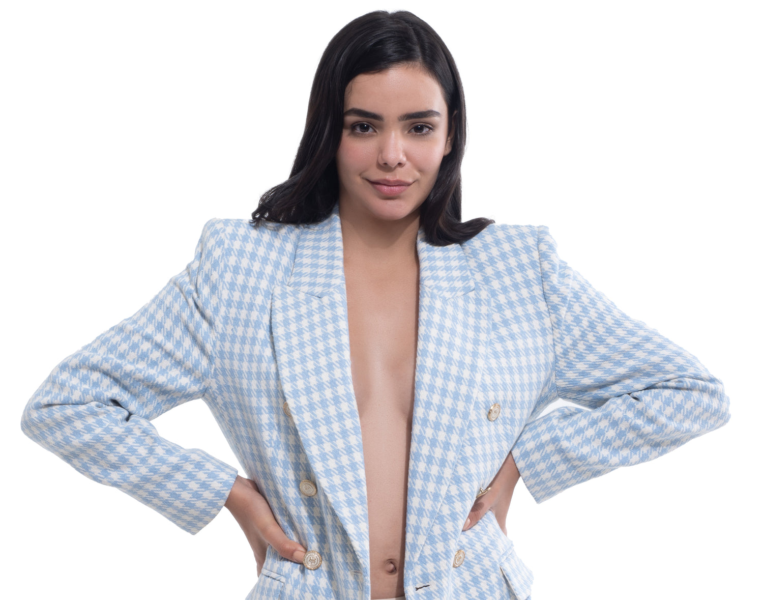 Model wearing a blazer with Nippetals adhesive nipple covers underneath, showcasing discreet support and seamless coverage