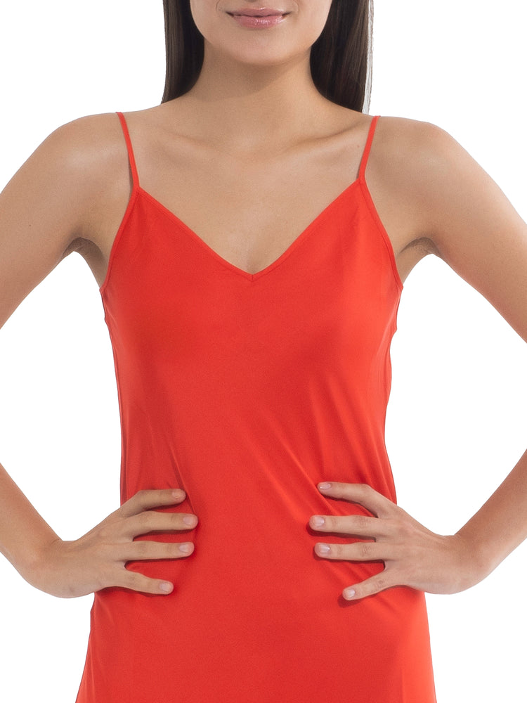 Model in an orange dress, showcasing a smooth, polished look after applying Nippetals NipGrips