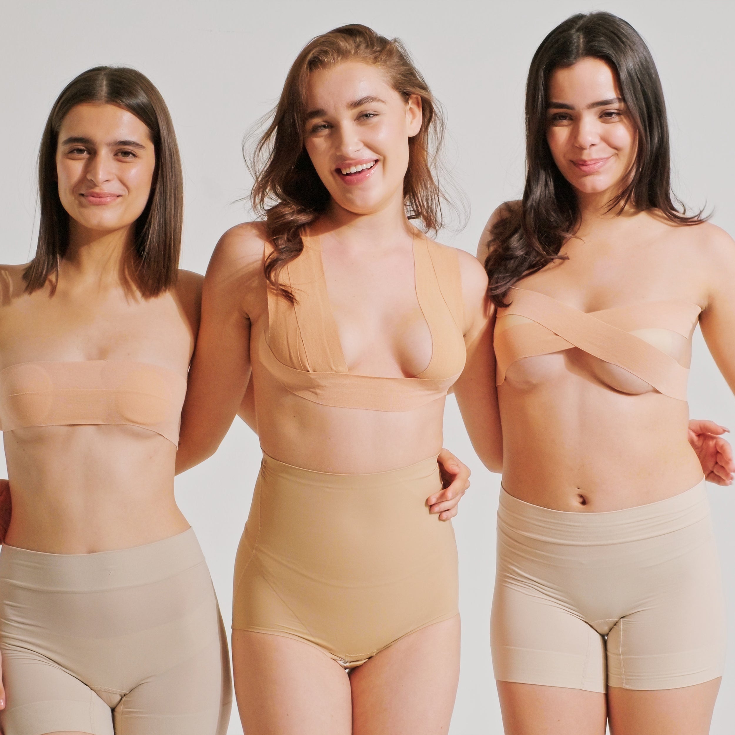Three women posing confidently in Nippetals GlamTape, showcasing enhanced lift and support