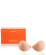 Nippetals BareEase adhesive bra displayed in front of its packaging box, showcasing its design and secure, strapless fit
