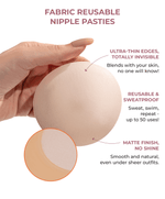 A hand holding a fabric reusable nipple pasty with features like ultra-thin edges and matte finish, sweatproof and invisible design highlighted