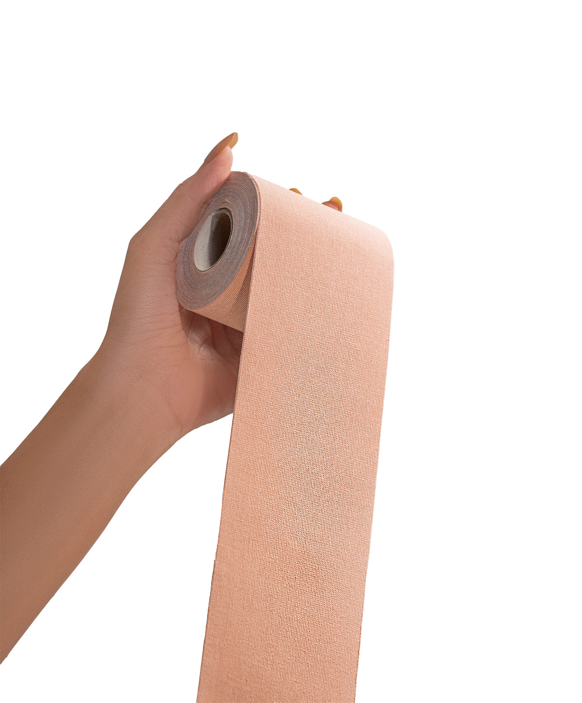 Hand holding Nippetals GlamTape, showing its compact design and comfortable adhesive, ideal for providing the prefect fit