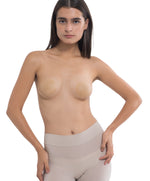 Model posing confidently in Nippetals NipGrips non-adhesive nipple covers, showcasing smooth, seamless support