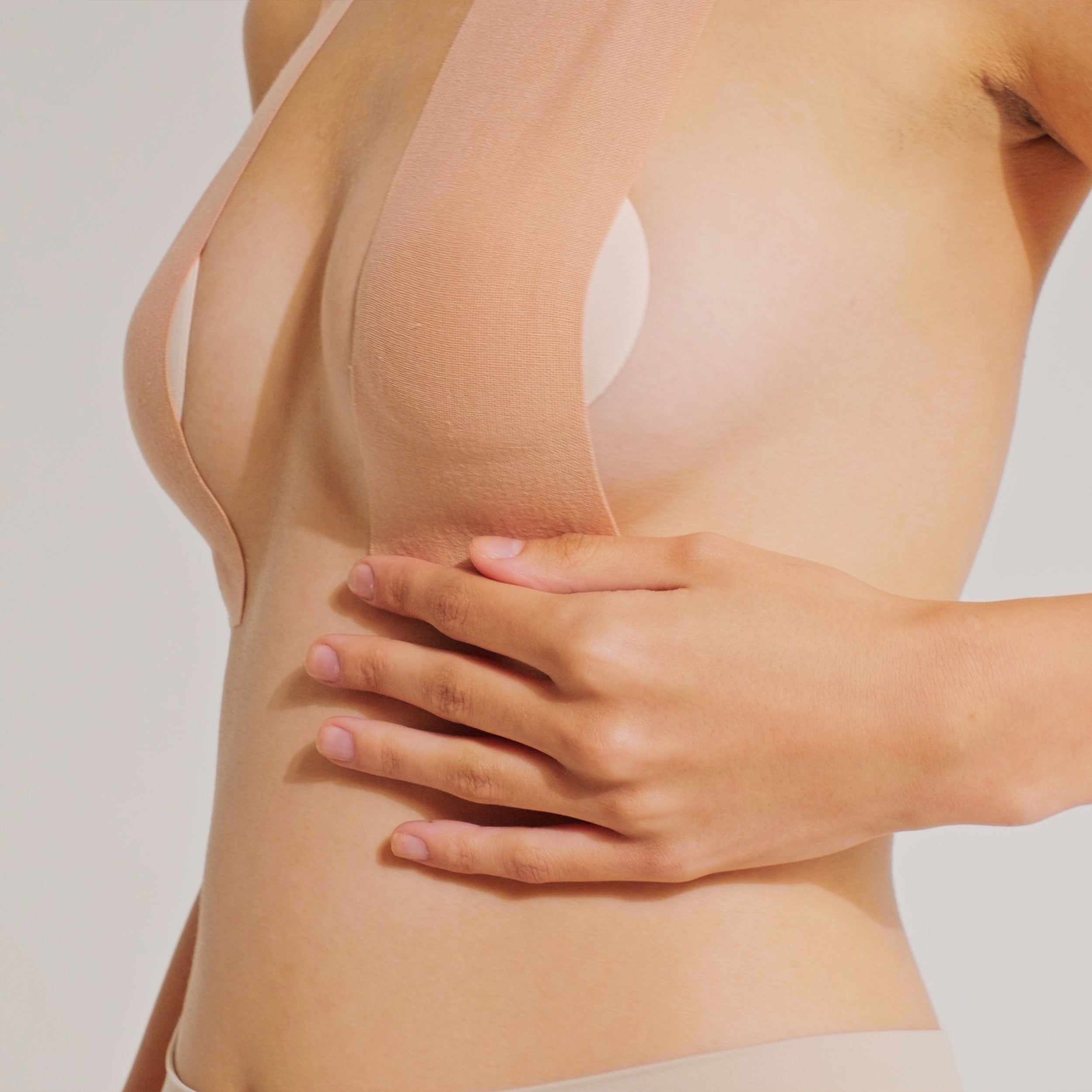 Model smoothing Nippetals breast tape for a wrinkle-free application and secure fit