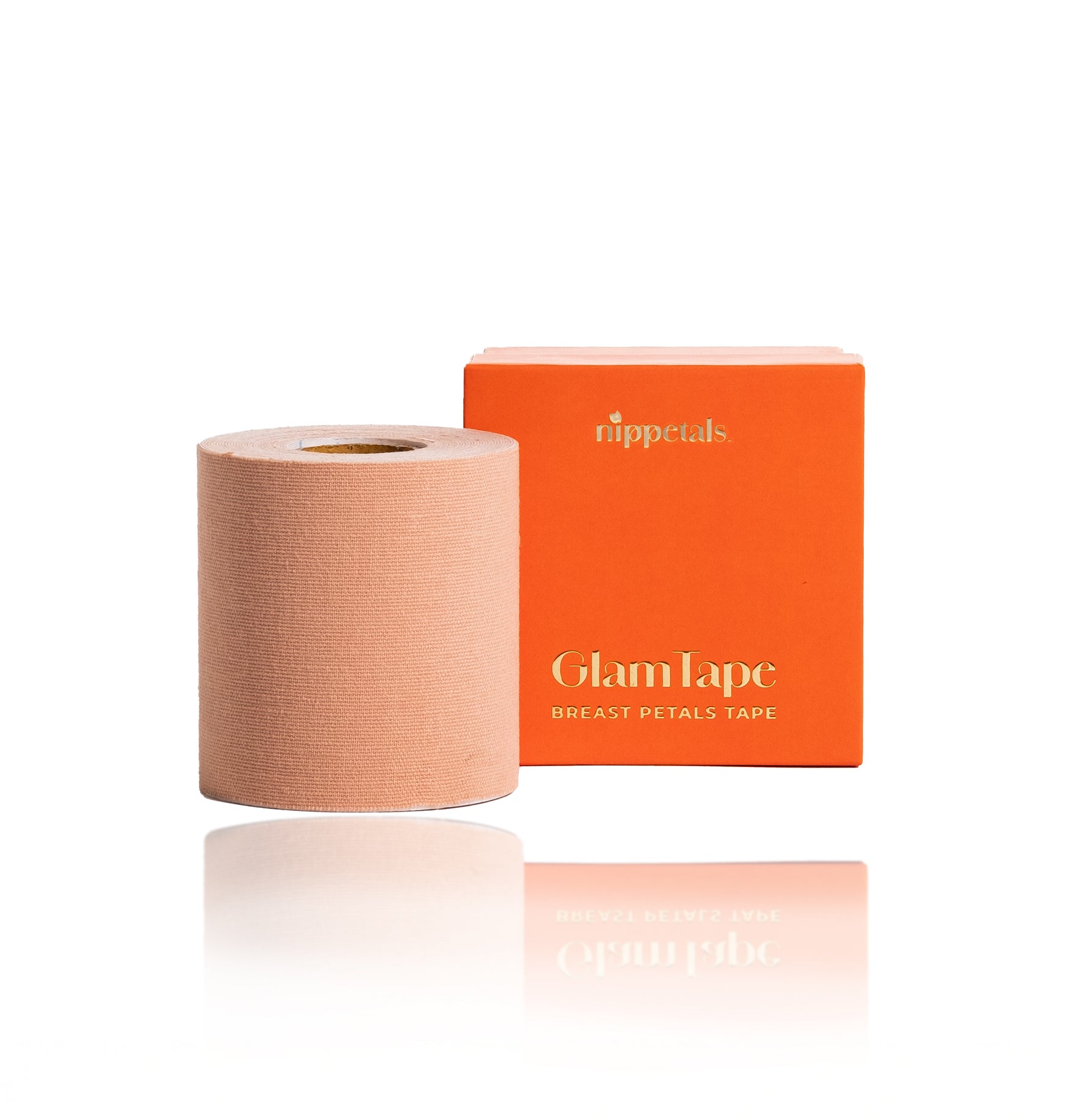 Nippetals GlamTape displayed in front of its packaging box, highlighting the sleek design and comfortable adhesive